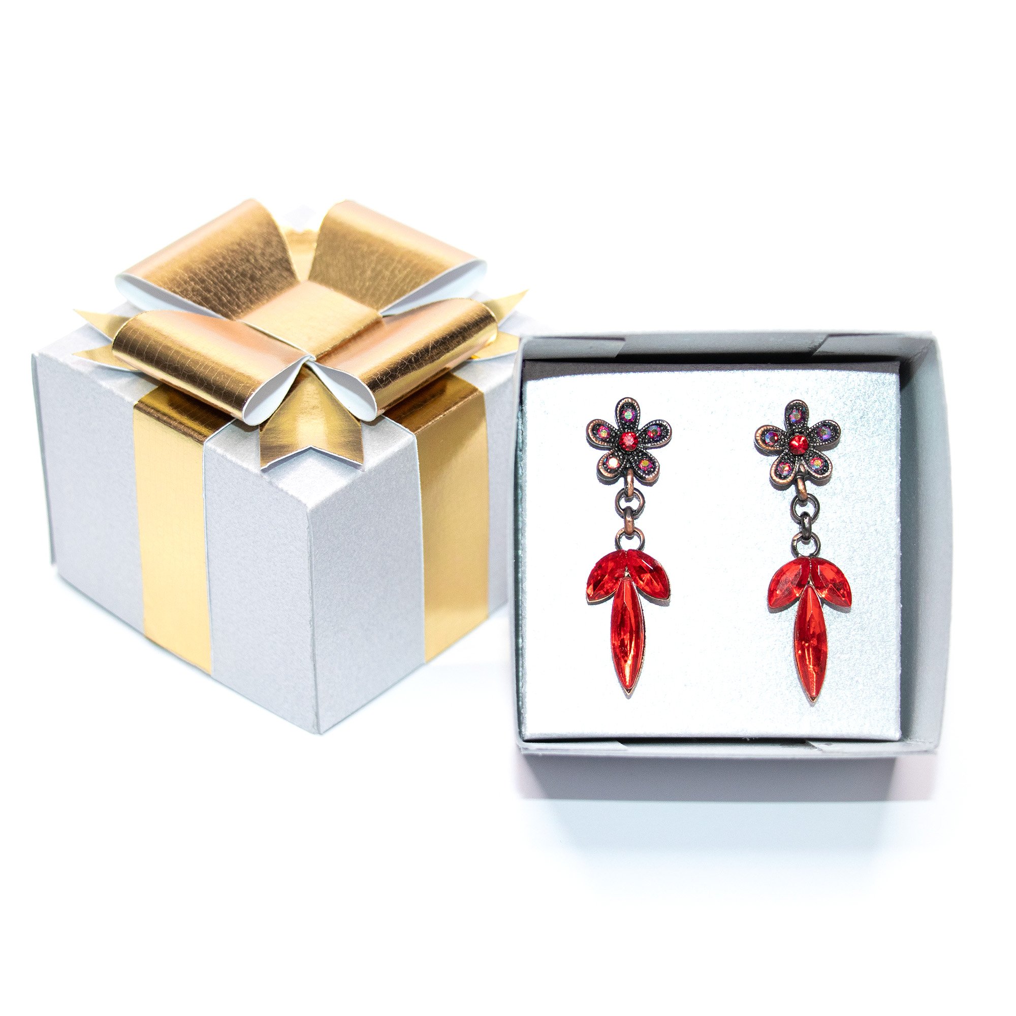 Silver textured cardstock 3D jewelry gift box with a gold paper ribbon and layered bow, shown closed, open with red crystal drop earrings on a white insert, open with a gold ring on a ring insert, and beside a silver and gold metallic version, a jewelry packaging cut file for Silhouette Studio