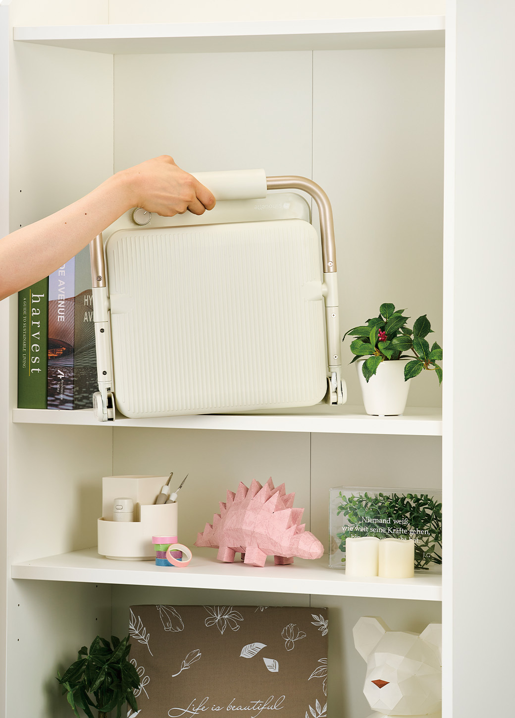 Silhouette cloChé Heat Press being placed on book shelf