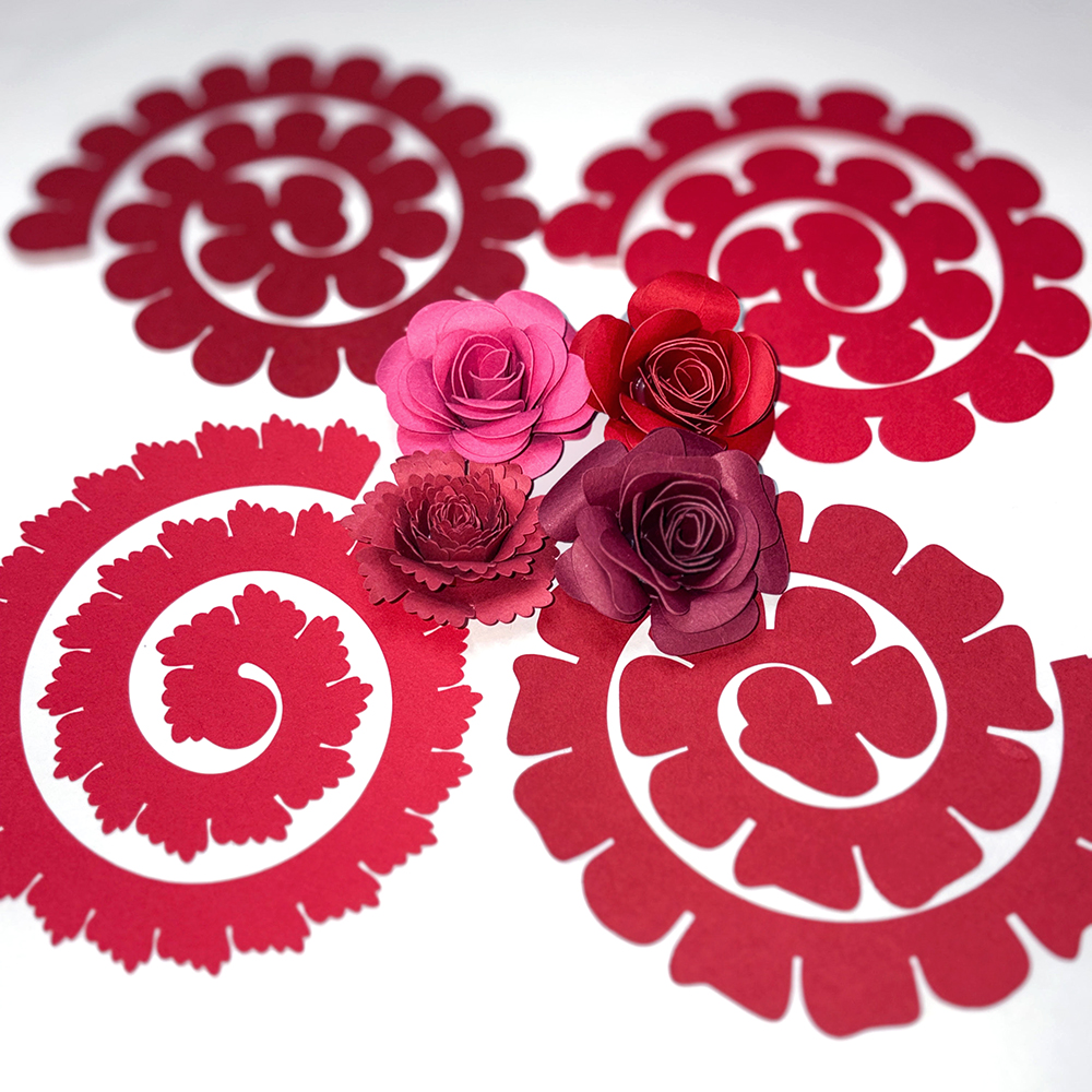 Rolled Paper Flower choices for shadow box featuring pink, red and burgundy flowers and svg cut designs.